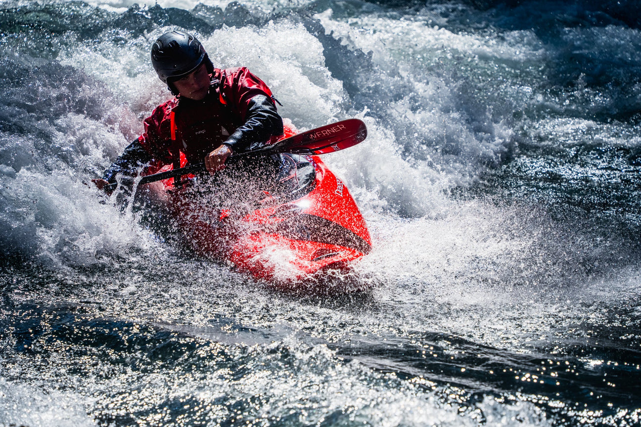 Dagger whitewater kayak being paddled on a river