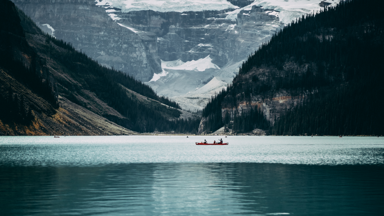 Canoe paddlers on a mountain lake