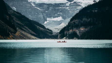Canoe paddlers on a mountain lake