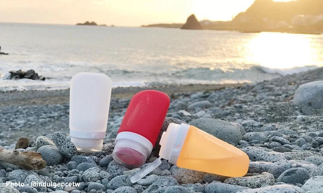 Humangear GoToob travel bottles on a beach