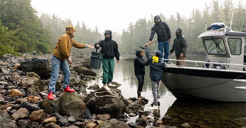 Person wearing XTRATUF waterproof boots outdoors
