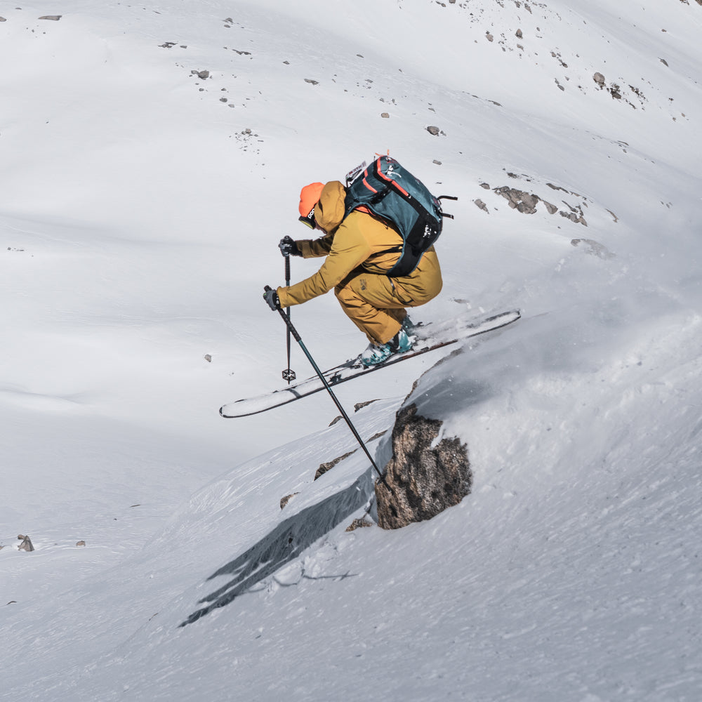 Backcountry skier descending with ATK touring gear