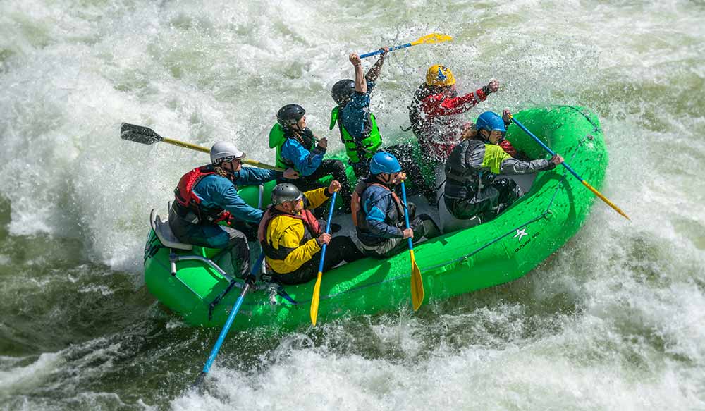 NRS paddling gear on a whitewater rafting trip