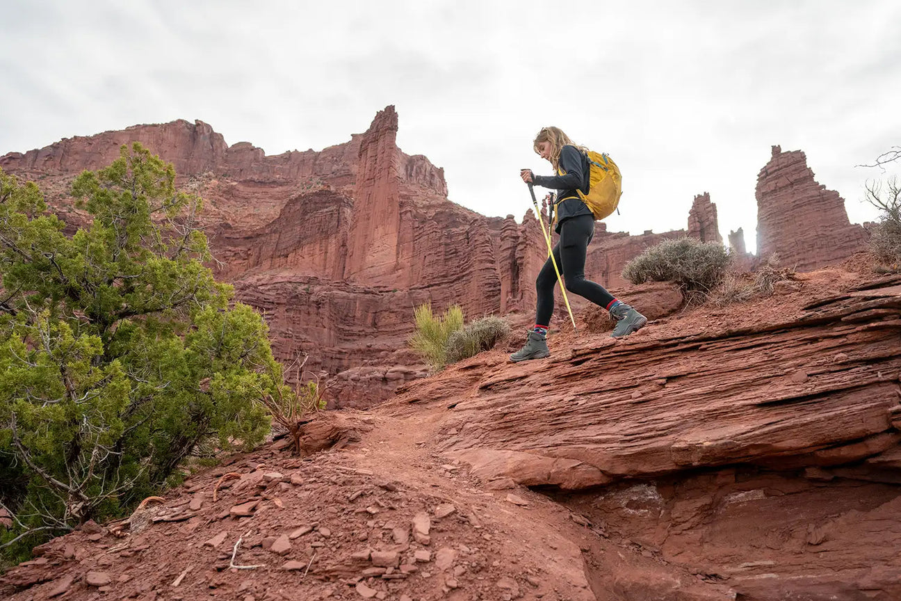 Hiker wearing LOWA boots on a rocky trail